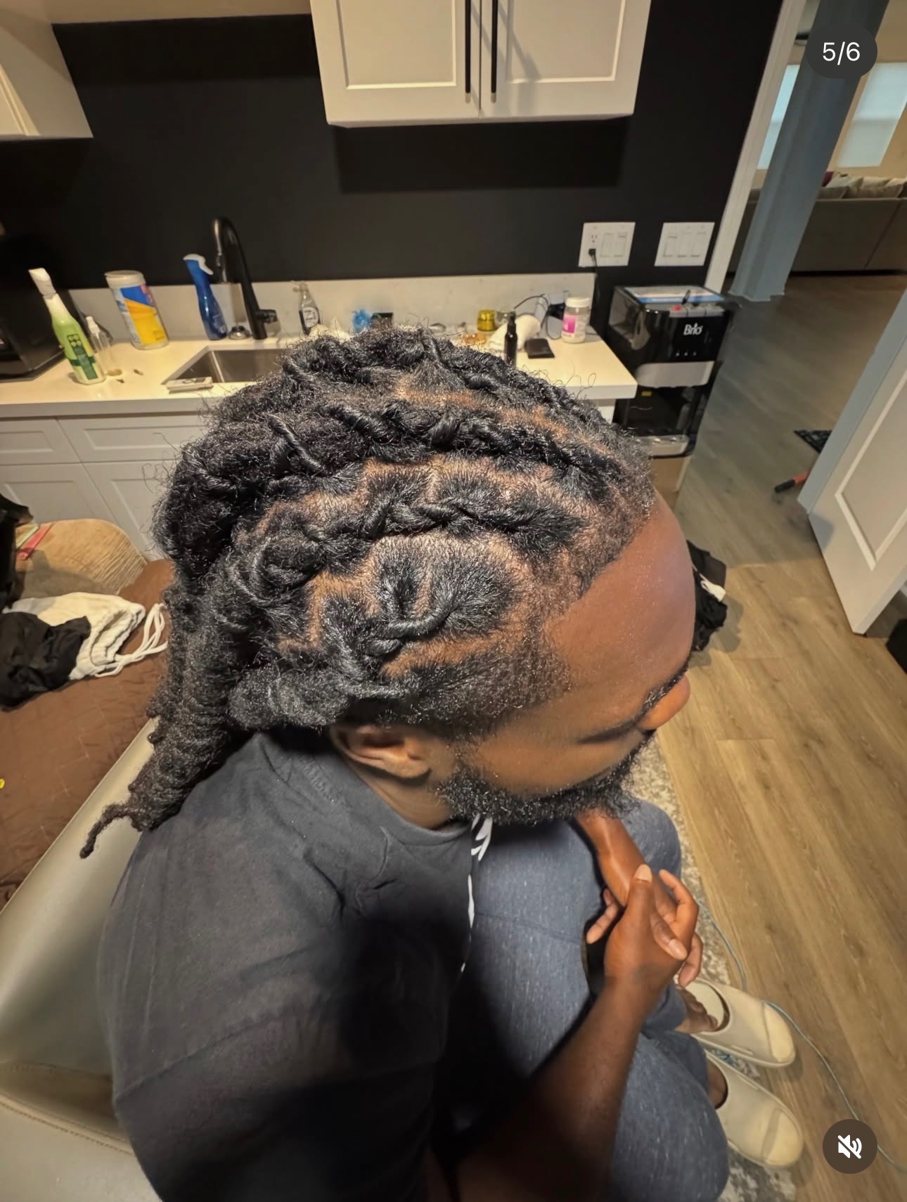 Loc retwist and style by Mook, angled view