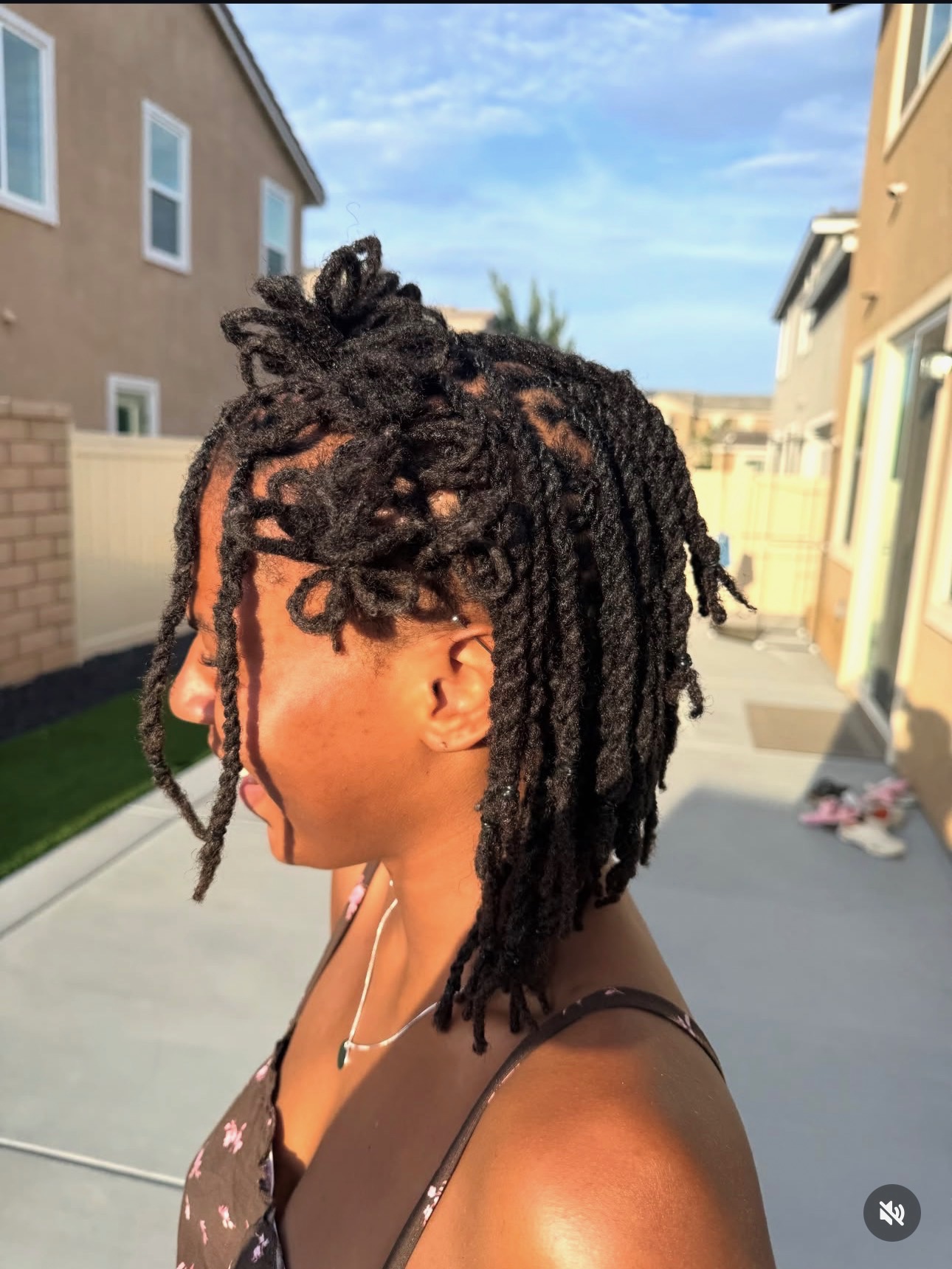 Styled locs by Mook, side view
